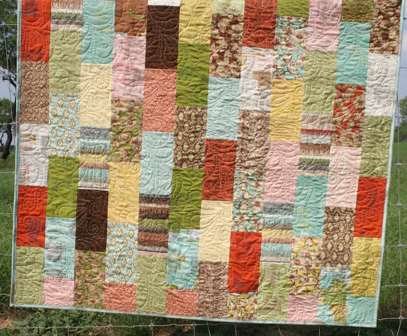 Easy precut quilt pattern designed for beginners using layer cakes and 10 inch fabric squares to create modern baby quilts and cozy throw quilts