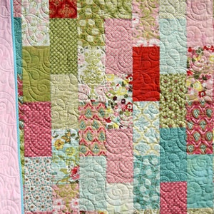 Easy baby quilt pattern PDF using 10 inch precut fabric squares and layer cakes for modern handmade nursery quilts and baby shower gifts