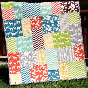 Beginner-friendly quilt pattern PDF featuring oversized patchwork blocks and modern fabric placement for baby quilts, throw quilts, and bed-size quilts