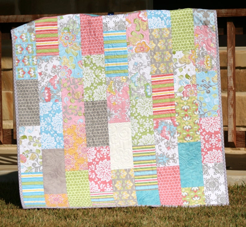 Instant download PDF quilt pattern featuring a modern patchwork quilt layout that beautifully showcases coordinated fabric collections and novelty prints