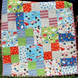 Bestselling beginner quilt pattern by Kristin Blandford Designs featuring an easy patchwork quilt design perfect for layer cakes, scrap busting, and modern quilting projects. The Whimsy Quilt Pattern is ideal for baby shower gifts, nursery decor, and handmade throw quilts.
