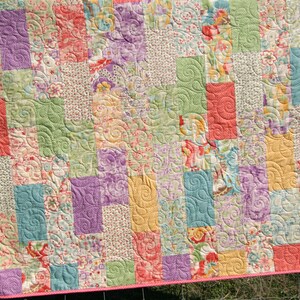 Digital quilt pattern instant download with modern geometric patchwork blocks designed for coordinated fabric collections and colorful precut fabrics