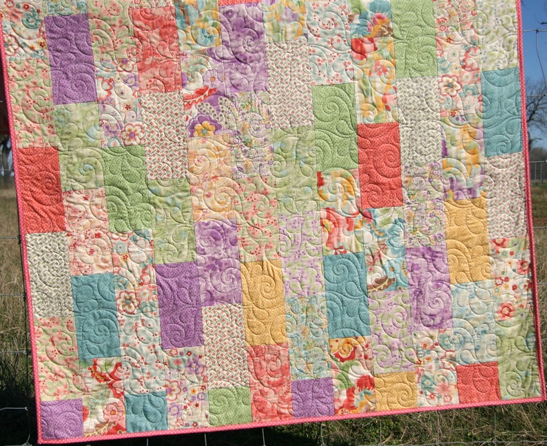 Digital quilt pattern instant download with modern geometric patchwork blocks designed for coordinated fabric collections and colorful precut fabrics