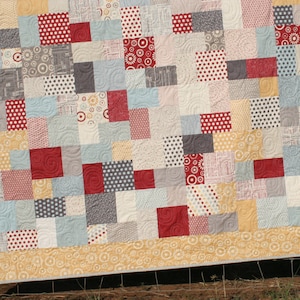 Beginner-friendly PDF quilt pattern with modern vintage patchwork styling and easy layer cake quilt construction for throw and baby quilts