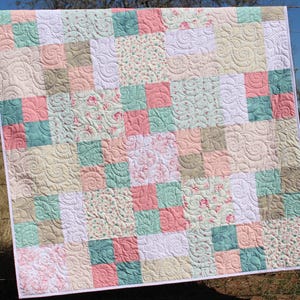 Whimsy Quilt Pattern digital download featuring a beginner friendly patchwork quilt layout with easy cutting and simple piecing designed for layer cakes and pre cut fabrics. This bestselling PDF quilt pattern is perfect for modern baby quilts, throw quilts, and cozy handmade gifts.