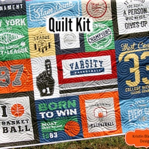May include: A quilt kit featuring a variety of colorful fabric squares with basketball-themed designs. The squares feature text such as "Tournament", "New York", "Varsity Basketball", "West Coast 33", "Born to Win", and "Every Game".
