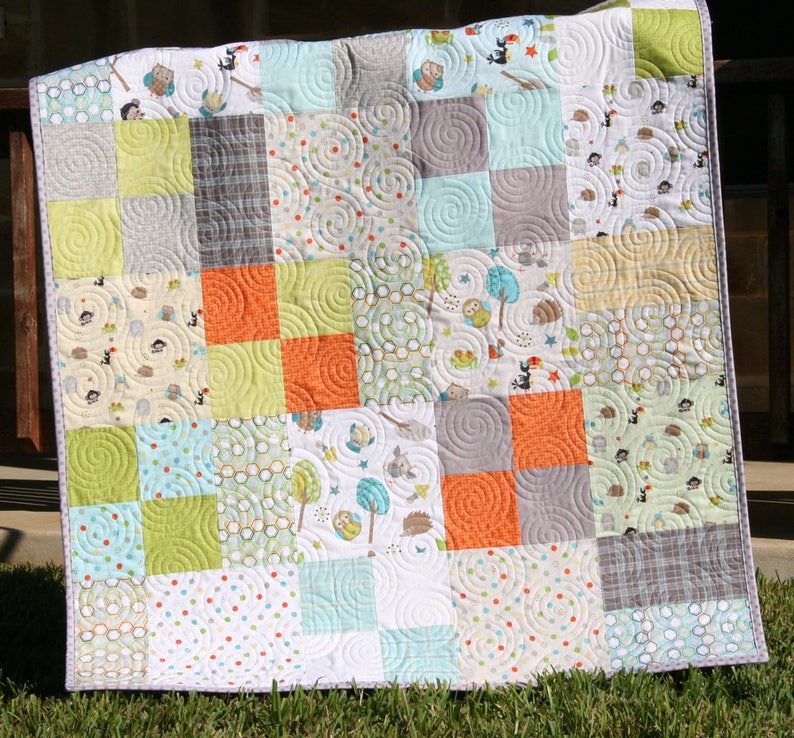 Easy layer cake quilt pattern featuring a bestselling patchwork design perfect for baby quilts, nursery quilts, and cozy lap throws. The Whimsy Quilt Pattern by Kristin Blandford Designs includes detailed instructions and easy to follow diagrams for beginner quilters and modern quilting projects.