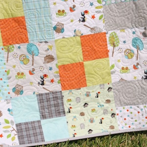 Beginner friendly patchwork quilt pattern for layer cakes and fabric stash projects featuring a modern quilt design with timeless appeal. The bestselling Whimsy Quilt Pattern by Kristin Blandford Designs is perfect for baby quilts, throw blankets, and quick sewing projects.