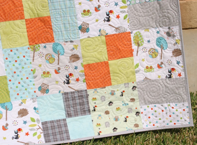 Beginner friendly patchwork quilt pattern for layer cakes and fabric stash projects featuring a modern quilt design with timeless appeal. The bestselling Whimsy Quilt Pattern by Kristin Blandford Designs is perfect for baby quilts, throw blankets, and quick sewing projects.