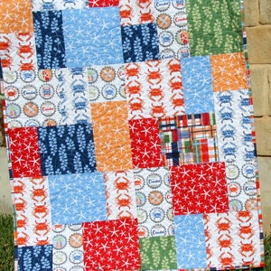 Easy modern quilt pattern PDF with oversized patchwork blocks and clean geometric lines perfect for showcasing trendy quilting fabrics