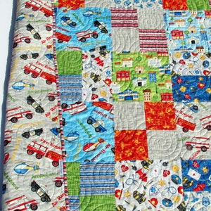 Bestselling Whimsy Quilt Pattern by Kristin Blandford Designs featuring a clean patchwork quilt layout designed for beginner quilters using 10 inch pre cut fabric squares. This easy modern quilt pattern is perfect for nursery quilts, handmade gifts, and cozy throw blankets.