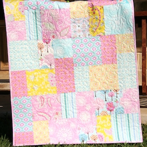 Large block quilt pattern for beginners featuring a modern layout that works beautifully with novelty prints, fat quarter bundles, and stash fabrics