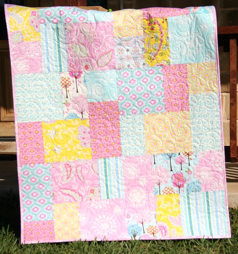 Large block quilt pattern for beginners featuring a modern layout that works beautifully with novelty prints, fat quarter bundles, and stash fabrics
