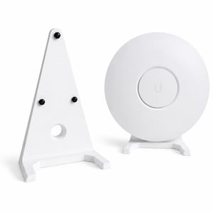 May include: A white triangular stand with three black circular feet and a central circular cutout, positioned next to a white circular wireless access point device featuring a central U logo and a flat base stand for upright placement.