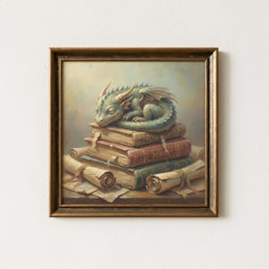 May include: A framed painting shows a sleeping baby dragon on a pile of old books and scrolls. The dragon is blue and green with small horns and wings. The books are various colours, and the frame is gold.
