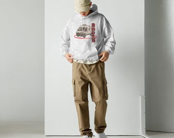 May include: A light gray hoodie with a graphic of a van and Japanese text. The hoodie has a drawstring hood and a kangaroo pocket. The person is wearing khaki cargo pants and white sneakers.
