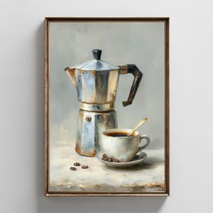 May include: A white ceramic mug with a black handle and the text "But First, Coffee" in a black, handwritten-style font. The mug is on a white surface.