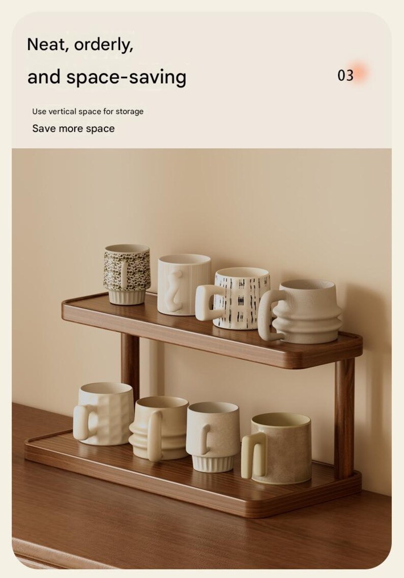 May include: A two-tiered wooden shelf holding eight ceramic mugs of various shapes and textures. The text at the top reads: Neat, orderly, and space-saving. Use vertical space for storage. Save more space. The shelf has a dark wood finish.