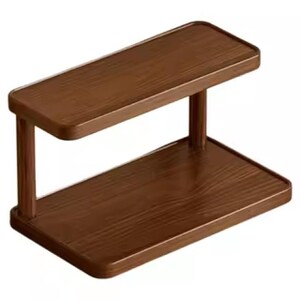 May include: A two-tier rectangular shelf unit constructed from dark brown wood with a visible grain pattern. The unit features a flat base and a matching upper shelf supported by two vertical pillars, creating an open storage structure.
