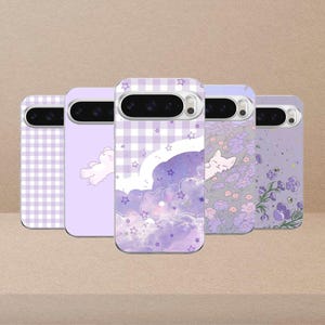 May include: Five phone cases with purple designs. The cases feature various patterns, including gingham, clouds, stars, a sleeping cat, and floral arrangements. The cases are in a row, showcasing the different designs.
