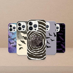 May include: A set of three ceramic mugs with a speckled, matte finish in cream, light grey, and dark grey. Each mug has a minimalist design, ideal for tea or coffee.