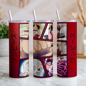 May include: Red tumbler with a white straw featuring manga-style panels of a character in action. The tumbler has the Japanese text "ワンピース" in black vertically on the side. The panels show the character in various poses and expressions.