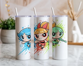 May include: Three white insulated tumblers with cartoon images of the Powerpuff Girls. Each tumbler features a different character with blue, red, and green accents, and a matching straw. The tumblers are designed for cold beverages.