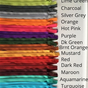 May include: A collection of 16 different colored zippers, including yellow, lime green, charcoal, silver grey, orange, hot pink, purple, dark green, burnt orange, mustard, red, dark red, maroon, aquamarine, turquoise, royal, and navy.