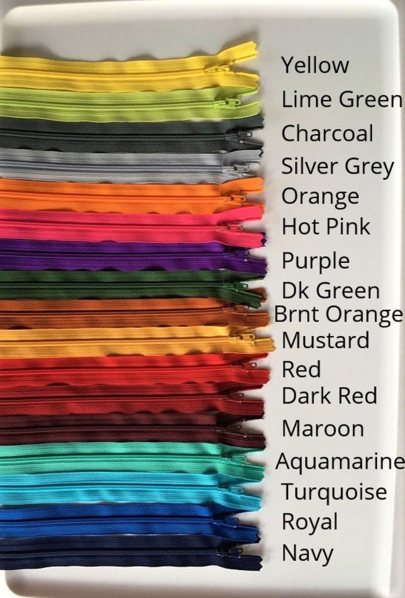 May include: A collection of 16 different colored zippers, including yellow, lime green, charcoal, silver grey, orange, hot pink, purple, dark green, burnt orange, mustard, red, dark red, maroon, aquamarine, turquoise, royal, and navy.