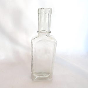 Antique Sauer&#39;s Extract Embossed Glass Bottle Cork Top Narrow Collectible 1800s to 1900s Skinny Window Sitter Small