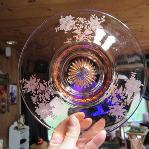 May include: A vintage pink depression glass plate with a cobalt blue center and etched floral design.