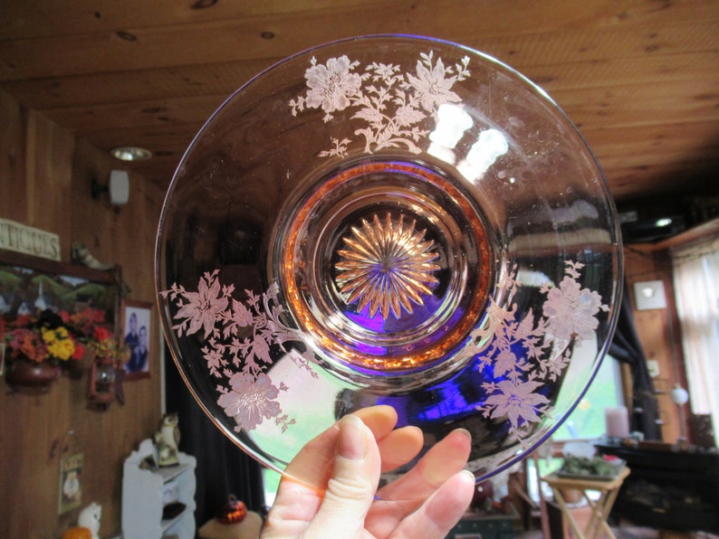 May include: A vintage pink depression glass plate with a cobalt blue center and etched floral design.