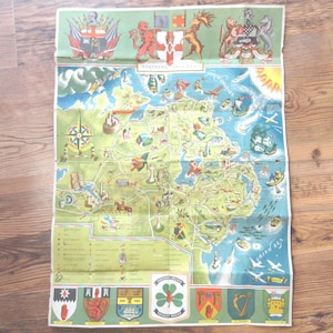 May include: Vintage map of Northern Ireland, featuring a detailed illustrated layout with a green and blue color scheme. The map includes various symbols, landmarks, and text, with a decorative border at the top and bottom.