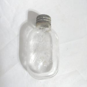 Antique Jaynes & Co. Glass Pill Bottle Boston Aluminum Cap Small Clear Flat Bottle Non Standing Round Bottom