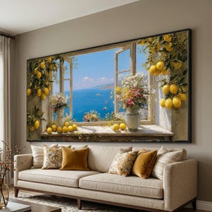 May include: A large framed canvas print depicts a scenic window view of the ocean and sky. The window is adorned with lemons and flowers. A beige sofa with decorative pillows sits below the artwork.