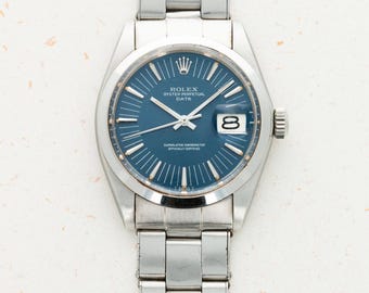 Reloj Rolex Oyster Perpetual Date vintage Ref. 1500 con índices largos y esfera azul de 34 mm – 1971