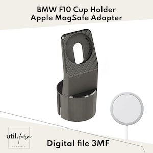 May include: A dark gray BMW F10 cup holder with an Apple MagSafe adapter. The adapter has a circular opening and a textured top. A white MagSafe charger is also shown. The text "BMW F10 Cup Holder Apple MagSafe Adapter" and "Digital file 3MF" are visible.
