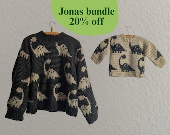 May include: Two sweaters, one adult and one child size, are displayed. The adult sweater is dark gray with tan dinosaur patterns. The child's sweater is tan with dark gray dinosaur patterns. The text "Jonas bundle 20% off" is in a green circle.