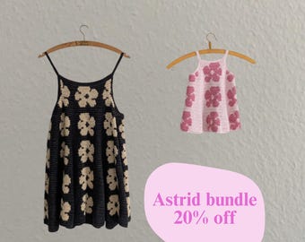 May include: Two crocheted tops on wooden hangers. One is black with cream-colored floral patterns, the other is pink with pink floral patterns. The image includes the text "Astrid bundle 20% off" in a pink bubble.