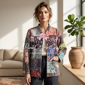 May include: A patchwork jacket with a variety of colorful patterns. The jacket has a mandarin collar and two pockets. The text "Pink City Art Craft Handmade Treasures" is visible on the jacket.