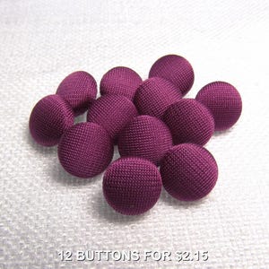 May include: Twelve purple fabric covered buttons.  12 BUTTONS FOR $2.15