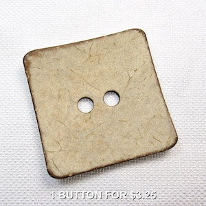 May include: A square button with two holes, made of a light tan material with a textured surface and a darker brown edge. The text "1 BUTTON FOR $3.25" is at the bottom.