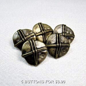 May include: Five antique brass-colored buttons with a cross design. Each button is round with a textured surface and a raised cross pattern. The buttons are arranged in a cluster on a white background.