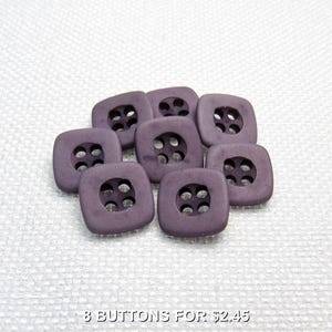 May include: Eight purple square buttons with four holes each.  "8 BUTTONS FOR $2.45" is printed below the buttons.