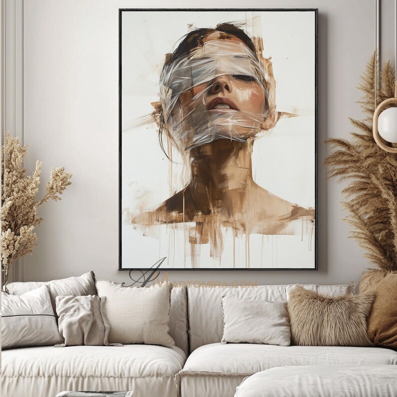 May include: An abstract painting of a person with their eyes closed and face wrapped in clear tape. The artwork uses a palette of browns and whites, with visible brushstrokes and a focus on texture. The painting is framed in a black border.