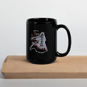 May include: Black ceramic mug with a character graphic, Japanese text, and the quote "Don't be afraid of death, be afraid of unlived life." The mug has a large handle and is suitable for hot or cold drinks.
