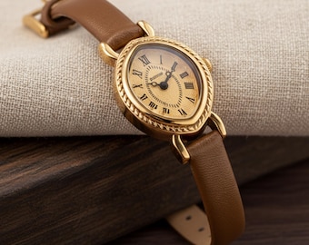 Vintage Gold Oval Watch: Brown Leather Strap, Roman Numerals