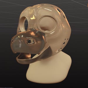 May include: A 3D-rendered, tan-colored animal head with large eye openings and a detailed snout. The head has several small holes and a smooth, reflective surface, suggesting a mask or sculpture.