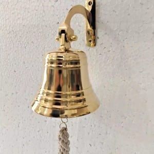 May include: A rustic wooden sign with the text "Welcome to our home" in white lettering. The sign features a distressed finish and a simple, inviting design, perfect for a front porch or entryway.