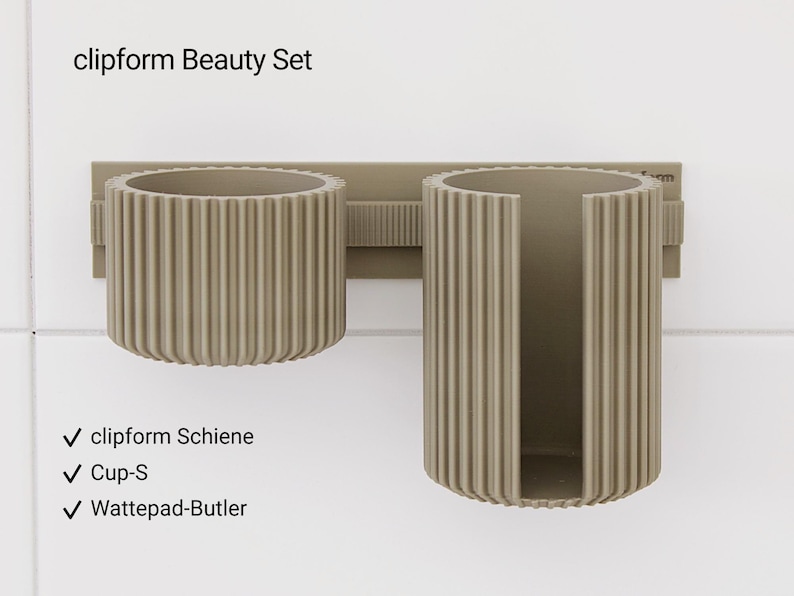 May include: A set of three ceramic mugs with a speckled, matte finish. The mugs are in shades of cream, light gray, and dark gray. Each mug has a simple, minimalist design, perfect for coffee or tea.